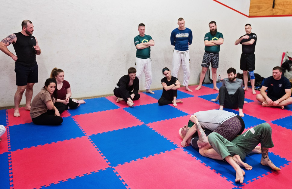The team at Arbtech practicing Brazilian jiu-jitsu together at ArbCon 2024