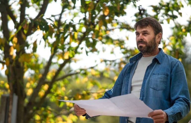 An architect reviewing development plans to see if any biodiversity net gain exemptions apply