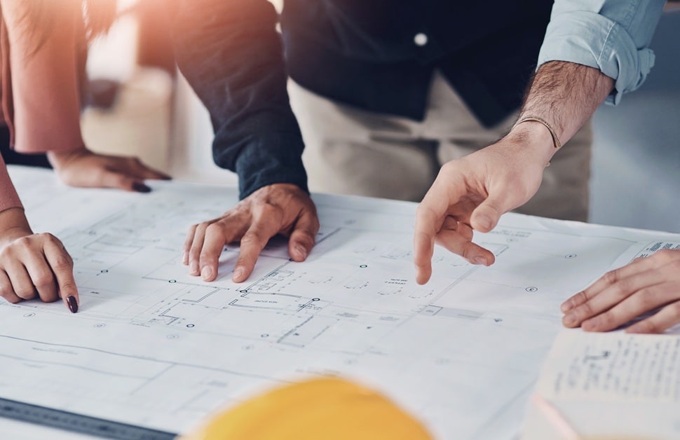 Architects and developers discussing how planning policy could affect the planned development