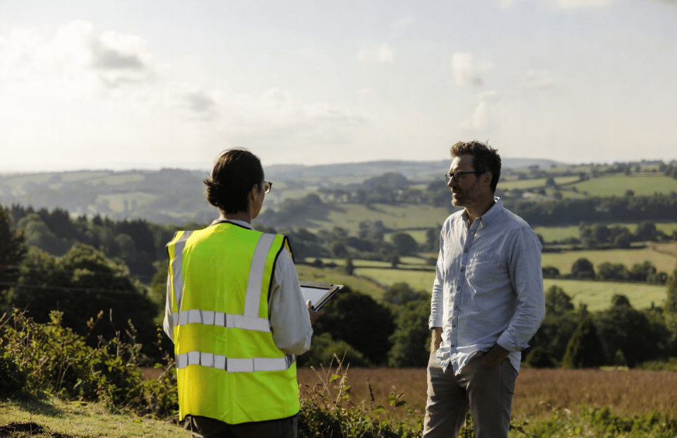 An architect speaking with an ecological consultant about development plans