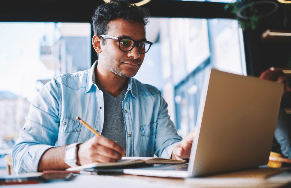 An inexperienced developer looking up the Countryside and Rights of Way Act 2000 on his computer and making notes
