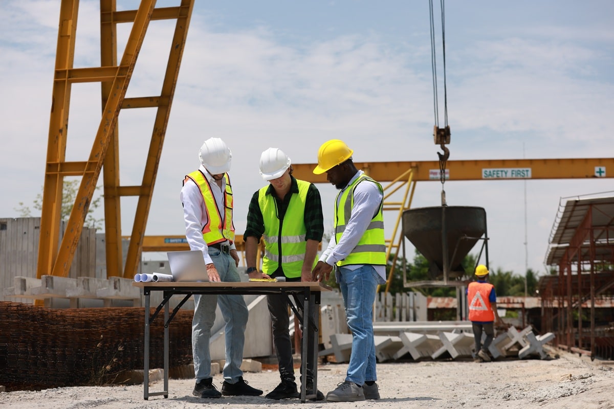A planning consultancy team monitors a building project.
