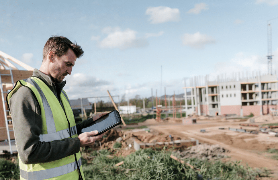 An ecologist making notes following a BNG assessment