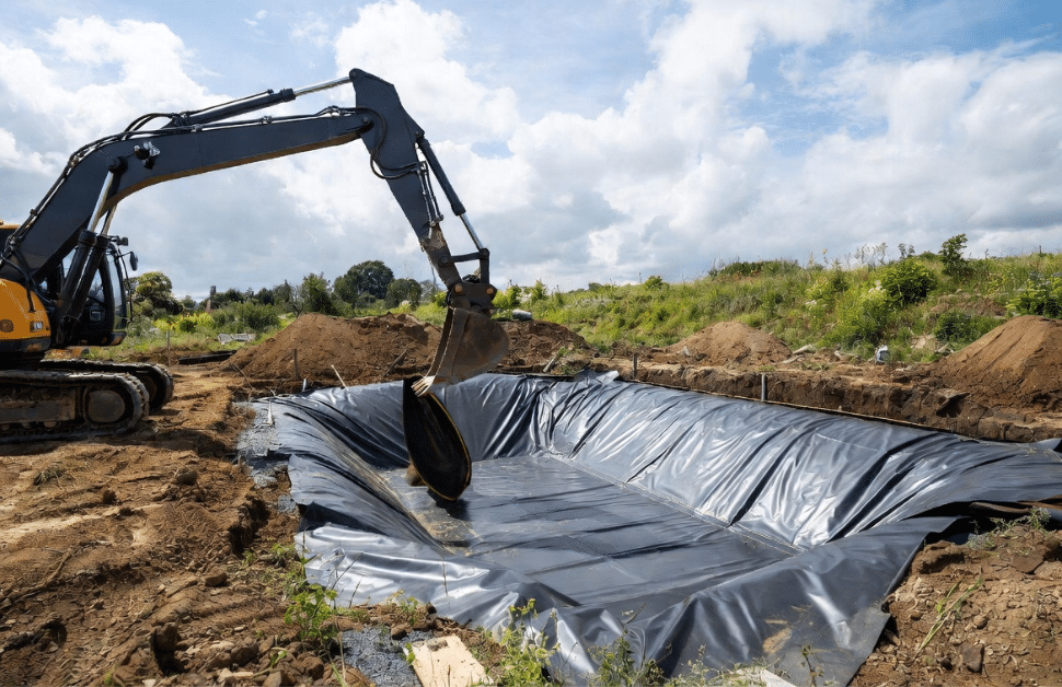 habitat creation services, involving a digger setting up a wildlife pond