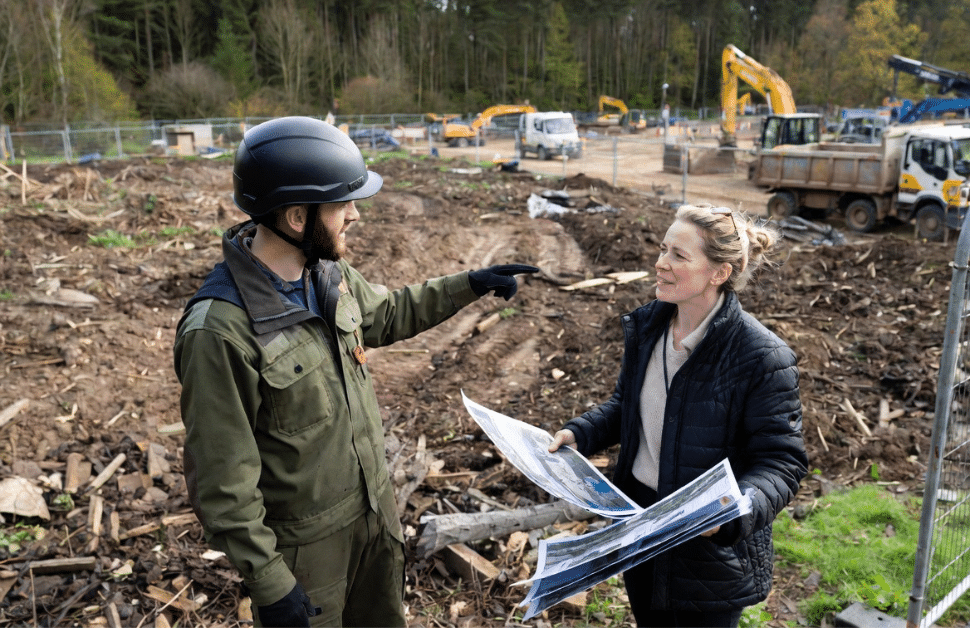 An ecological consultant explaining the impact of biodiversity net gain on nationally significant infrastructure projects to a developer
